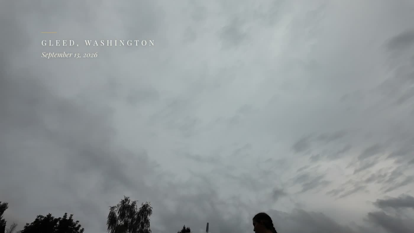 Grey rain clouds with a small location tag in the top left